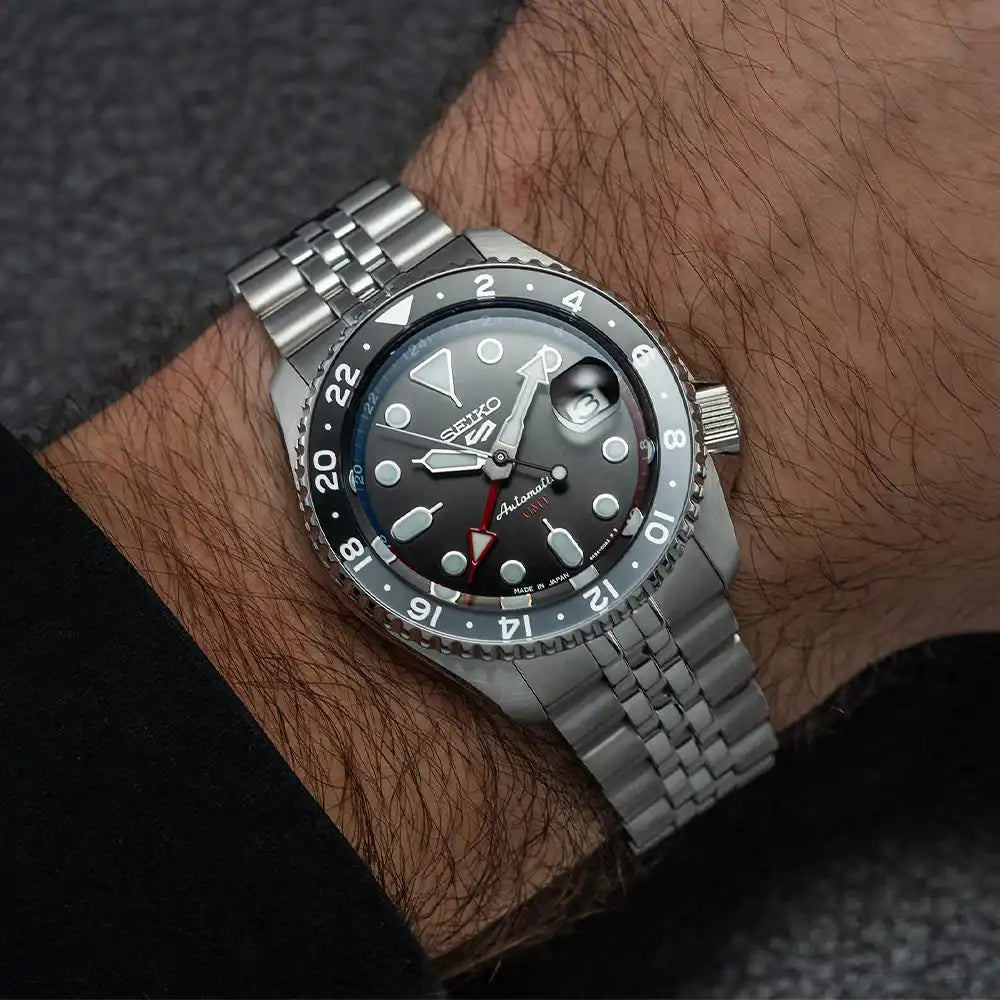 Seiko 5 100M GMT Style U.S. Special Black and Gray Bezel Red and Blue Inner Ring Charcoal Dial Stainless Steel Watch SSK019 J1