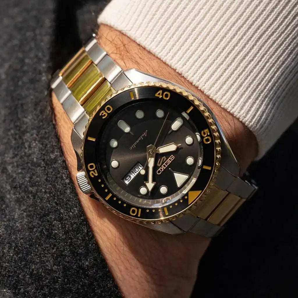 Seiko 5 Sports 100M U.S. Special Black Bezel Charcoal Dial 2-Tone Gold Plated Stainless Steel Watch SRPK22 J1