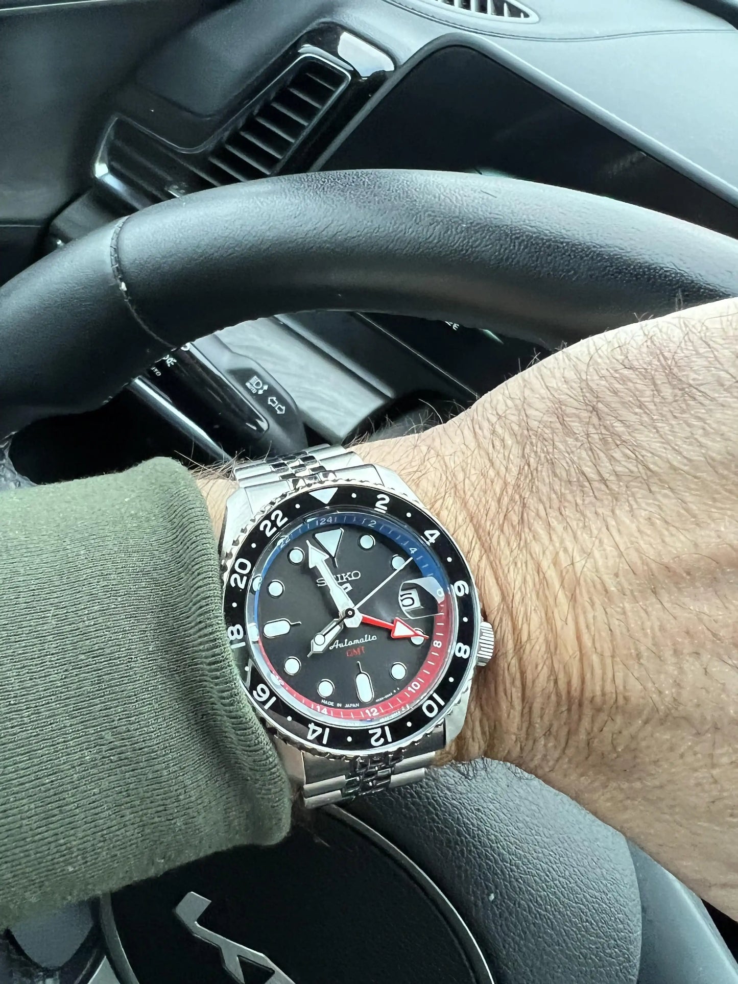 Seiko 5 100M GMT Style U.S. Special Black and Gray Bezel Red and Blue Inner Ring Charcoal Dial Stainless Steel Watch SSK019 J1